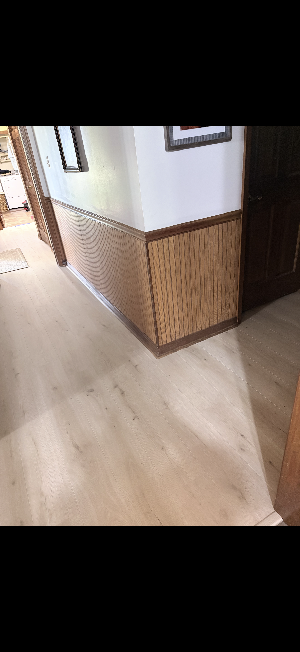 Newly installed vinyl plank flooring in hallway
