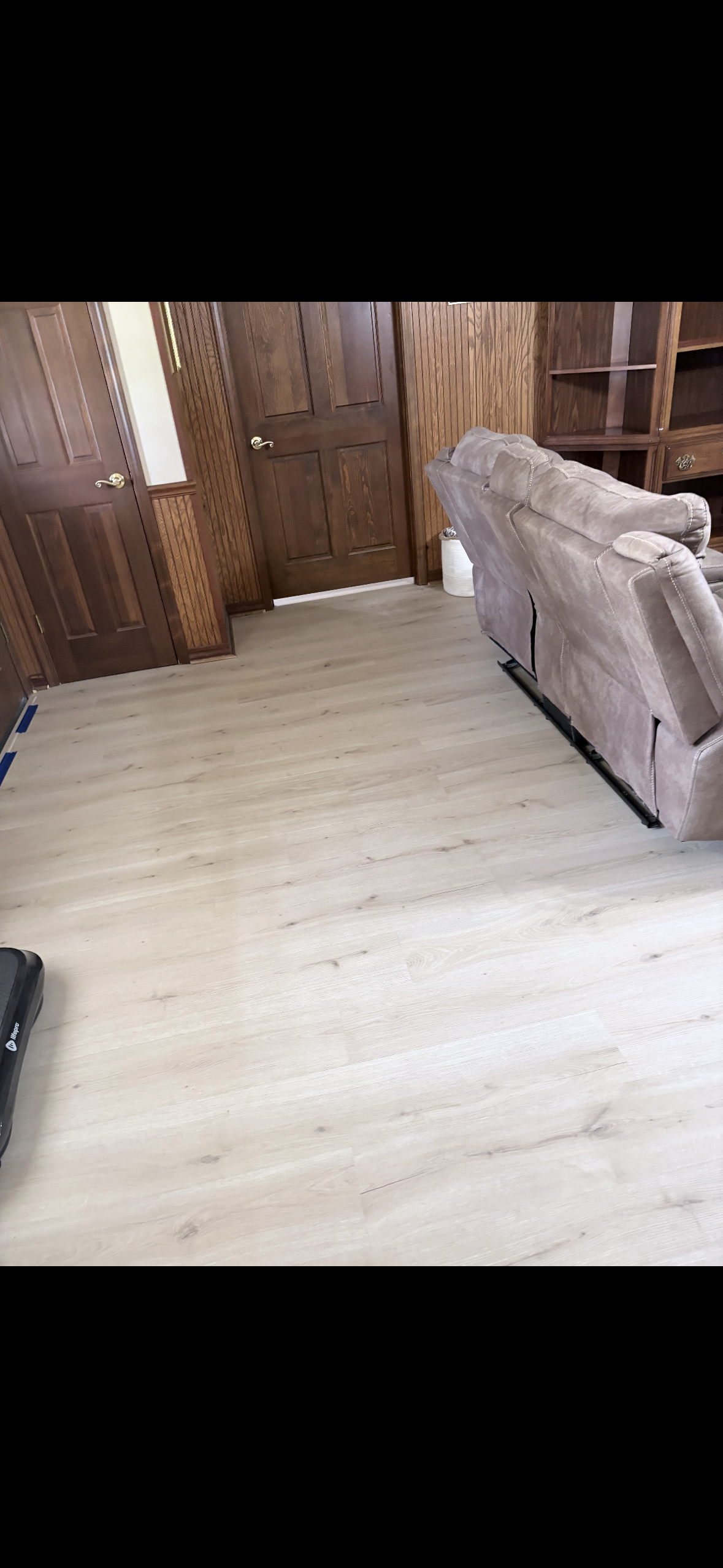 Finished living room with vinyl plank flooring