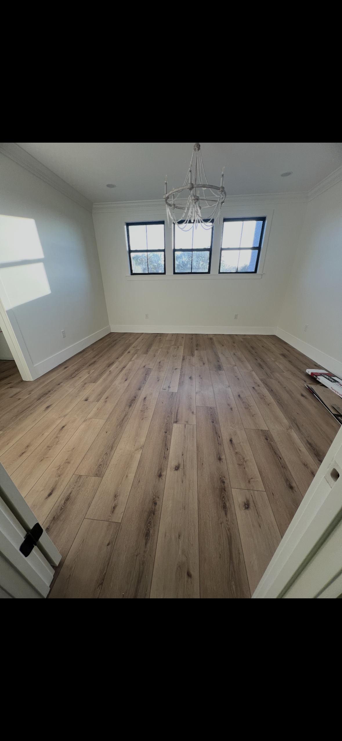 Vinyl plank flooring installed cleanly over a stepped transition
